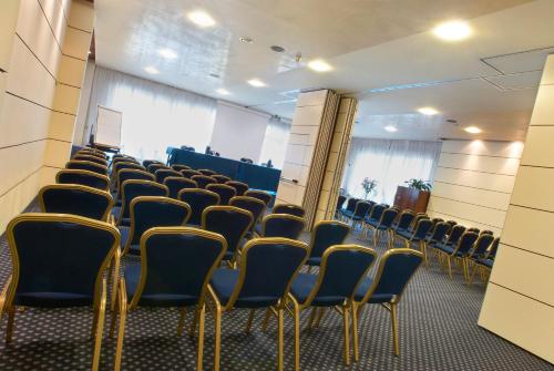 a room with rows of chairs in a room at Best Western Hotel Tre Torri in Altavilla Vicentina
