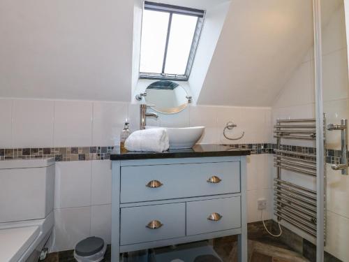 a bathroom with a sink and a sink at Dragon Hill Barn in Matlock