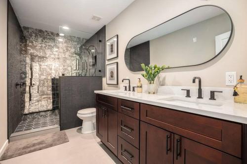 a bathroom with a sink and a shower with a mirror at Private Room, Kitchen & Bath 1 in Bradenton