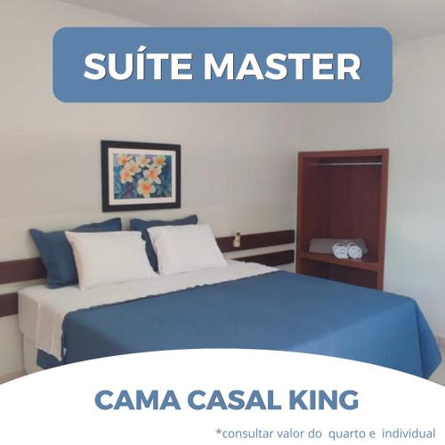 a poster of a bedroom with a bed with blue sheets at Hotel Master Cuiabá in Cuiabá