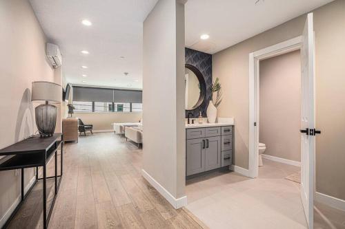 a living room with a sink and a mirror at Private Room, Kitchen & Bathroom 2 in Bradenton