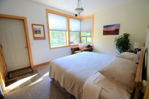 a bedroom with a large bed and a window at Slopeside in Brighton