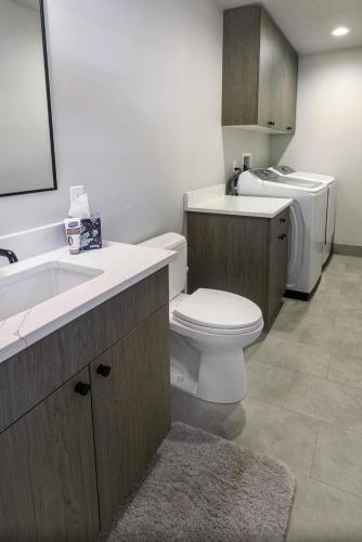 a bathroom with a white toilet and a sink at Private Home Perfectly Located at Brighton Ski Resort! in Brighton