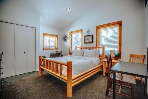 a bedroom with a bed and a table and a desk at Great Western in Brighton