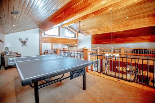 a ping pong table in a large room with a ping pong table at Castle Butenham in Brighton