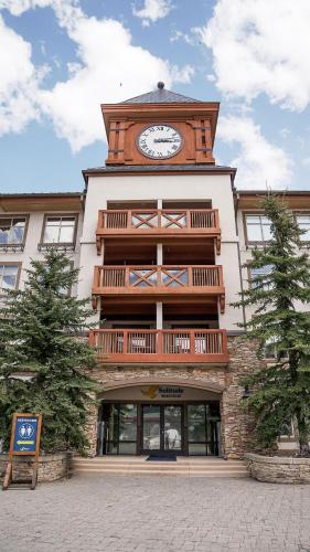 a building with a clock tower on top of it at Apex View in Solitude
