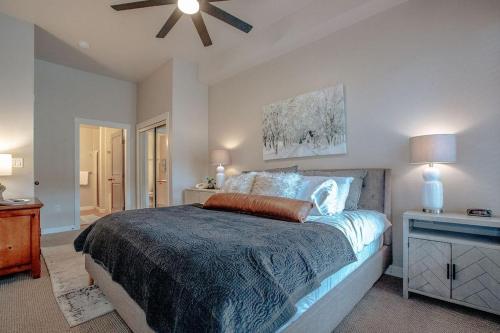 a bedroom with a bed and a ceiling fan at Poolside Pines Suite in Solitude