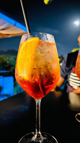 a drink in a glass sitting on a table at BBSUITE21 Maranello in Maranello