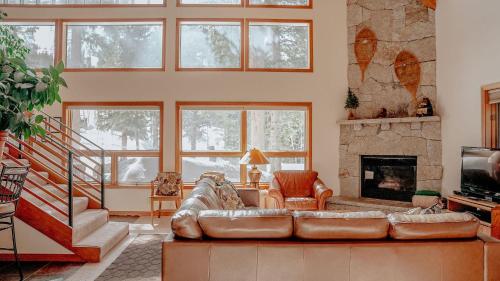 a living room with a couch and a fireplace at Stellar Haven in Brighton