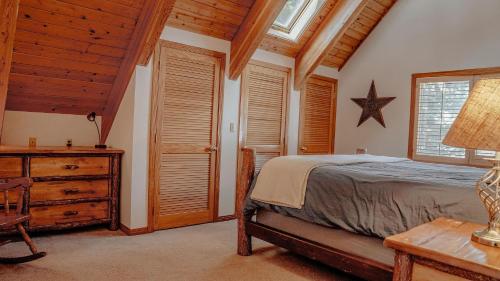 a bedroom with a bed and a wooden ceiling at Stellar Haven in Brighton