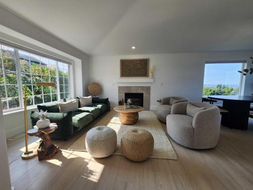 a living room with a couch and a fireplace at *NEW* Sunset Ridge Marysville 5 Beds 4 Baths in Marysville