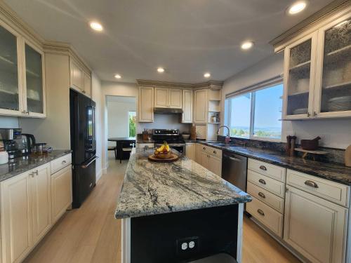 a large kitchen with a large island in the middle at *NEW* Sunset Ridge Marysville 5 Beds 4 Baths in Marysville