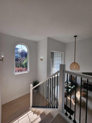 a staircase in a home with a window at *NEW* Sunset Ridge Marysville 5 Beds 4 Baths in Marysville