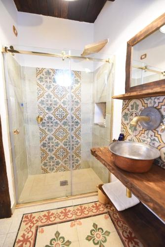 a bathroom with a shower with a sink at Casa Nonna Generosa in Agerola