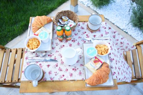 a picnic table with breakfast foods on it at Casa Nonna Generosa in Agerola