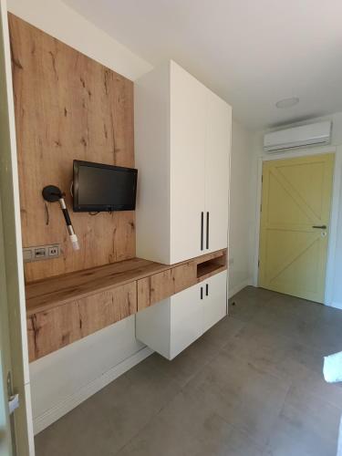 Kuchyň nebo kuchyňský kout v ubytování Kumkat Hotel