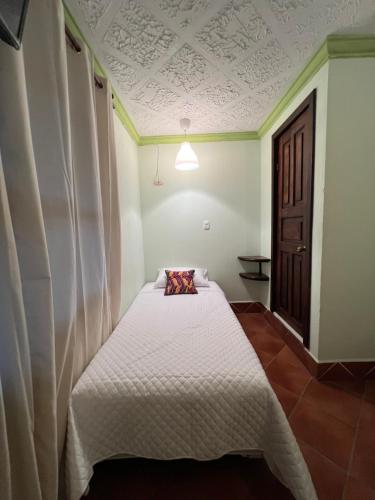 Postel nebo postele na pokoji v ubytování Hotel Makani