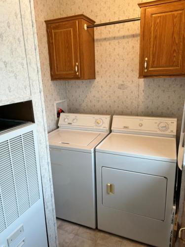 a laundry room with a washer and dryer at Death Valley PrairieFire 3bd 2ba Home w Kitchen in Pahrump