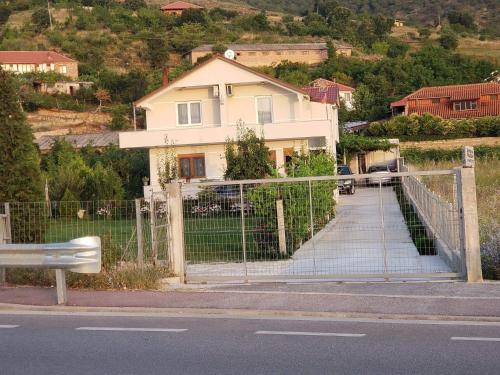 a gate in front of a house on a hill at Villa Rejan in Pogradec