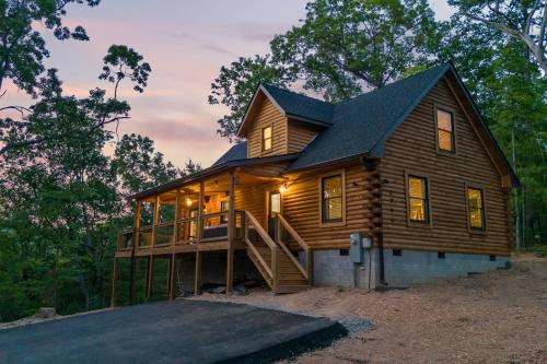 a large wooden house with a large deck at Bear's Hideaway in Sevierville