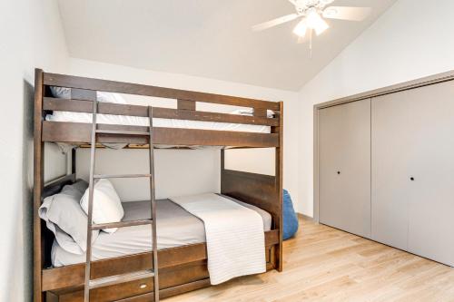 a bedroom with bunk beds with a ceiling fan at Modern Georgetown Home Less Than 2 Mi to Blue Hole Park! in Georgetown