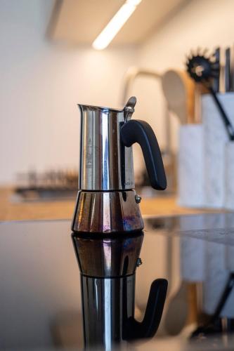 a coffee pot sitting on top of a counter at Au petit mouton in Fernelmont