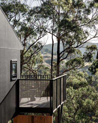 a balcony of a house with a view at Hunter Huon Valley Cabin One in Glen Huon