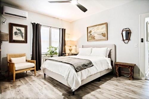 a bedroom with a bed and a chair at Budget Studio Near Paseo Art & Uptown Okc #03b in Oklahoma City