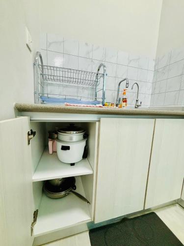 a kitchen with a sink and a counter top at Nerv Seaview T1-22 in Kota Kinabalu