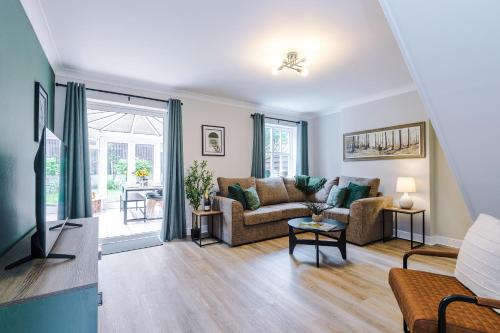 a living room with a couch and a tv at NEW! Stunning 3-Bed Home in Chester by 53 Degrees Property, Ideal for Groups, FREE Parking! in Chester