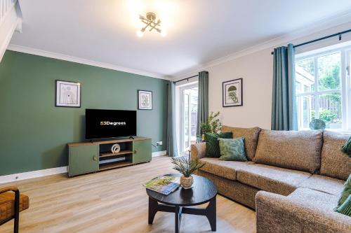 a living room with a couch and a tv at NEW! Stunning 3-Bed Home in Chester by 53 Degrees Property, Ideal for Groups, FREE Parking! in Chester