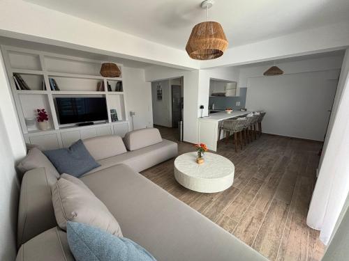 a living room with a couch and a table at Paros Relux in Kampos Paros