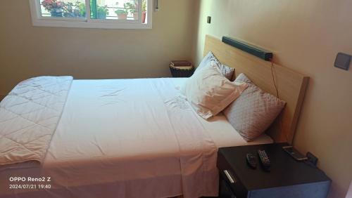 Ένα ή περισσότερα κρεβάτια σε δωμάτιο στο Superbe appartement familial
