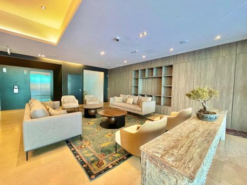 a living room with a couch and a table at SHG Liv Zona G Hotel in Bogotá