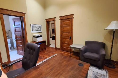 a living room with two chairs and a desk at Low Tax Luxe Mountain Getaway by Aspen in Carbondale