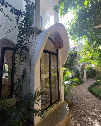 a building with a window on the side of it at OMA WATU DOME VILLAS in Pacitan