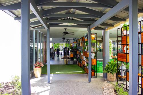 a library with shelves of books in a building at Heritage Park Hotel in Honiara