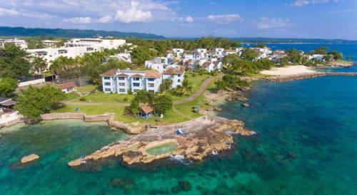 an aerial view of a resort on a island in the water at Casa Mire-Lee, Seaside Serenity at Negril 7 miles Beach, Point Village in Negril
