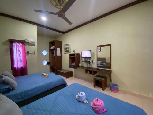 Ένα ή περισσότερα κρεβάτια σε δωμάτιο στο Chalet TM3 Langkawi