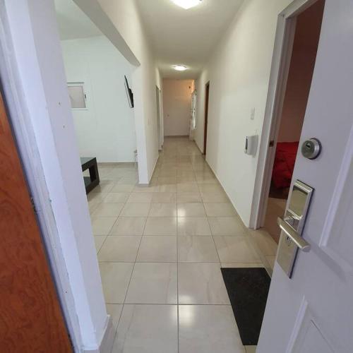 a hallway of a room with a tile floor at Departamento centrico - con todos los servicios - Facturamos in Durango