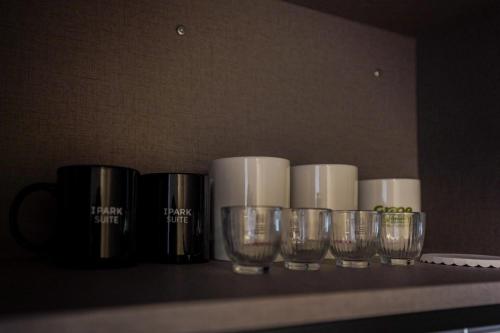a row of glasses sitting on a shelf at More than Sokcho in Sokcho