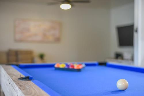 a pool table with a ball on top of it at Texas Vacation Home, Game Room & Pool By Sixflags in San Antonio