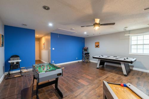 a room with a ping pong table and a ping pong table at Beautiful Texas Ranch House, Game Room & Minigolf in San Antonio