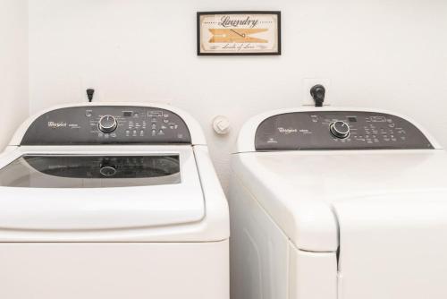 two machines sitting next to each other in a room at Luxury 6br Home, Game Room By Lackland & Seaworld in San Antonio
