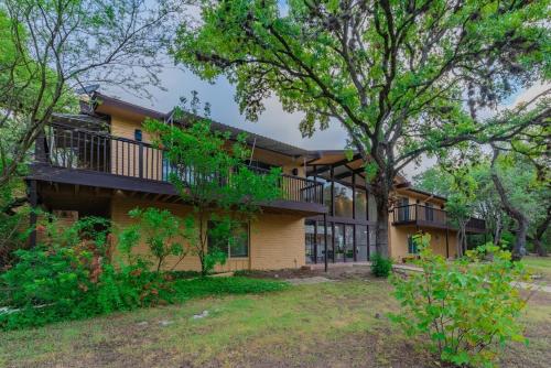 an exterior view of a house with a balcony at Luxury House By Fiesta Texas & Seaworld With Pool in San Antonio