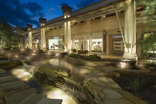 a building with a fountain in front of a building at Luxury House By Fiesta Texas & Seaworld With Pool in San Antonio