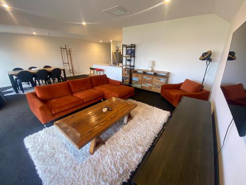 a living room with a couch and a coffee table at Lot 7 in Lake Tekapo