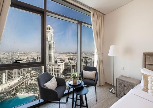 a hotel room with a view of a city at Palace Residences 2BR with Stunning Creek Views in Dubai