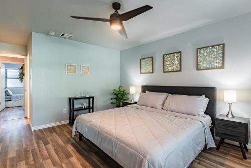 a bedroom with a bed and a ceiling fan at Stunning Pool Overlooking Golf Course & Game Room in San Antonio