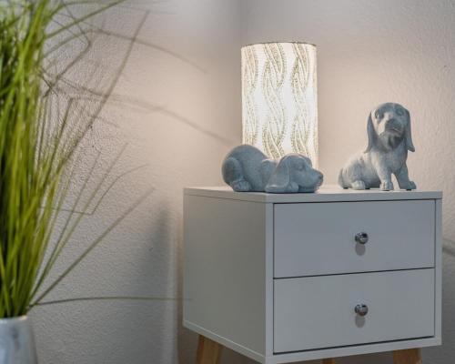 a dresser with a dog and two stuffed animals on it at Stunning Pool Overlooking Golf Course & Game Room in San Antonio